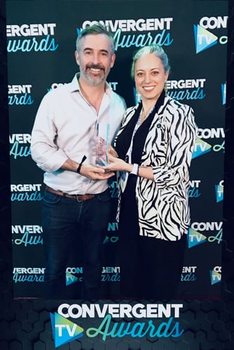 EX․CO accepts Convergent TV Award.