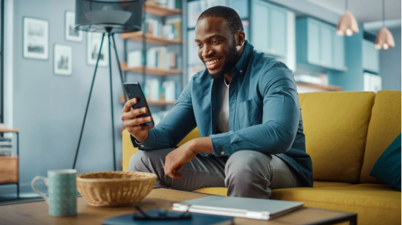 A user engaging with a mobile experience during the big game.